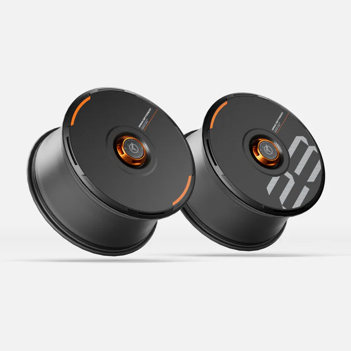 Pair of HALODISC 2 black Tesla wheel covers with orange accent rings